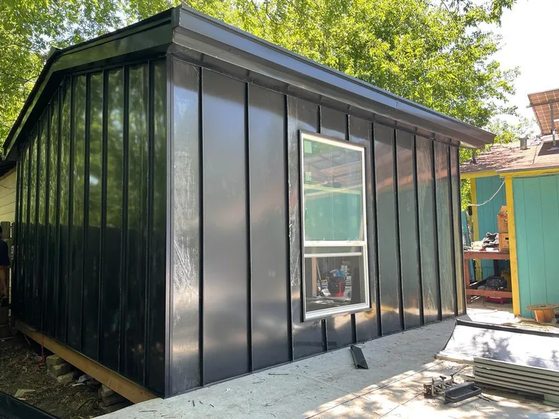 Black standing seam metal wall panels for Roof Inspection in Barling